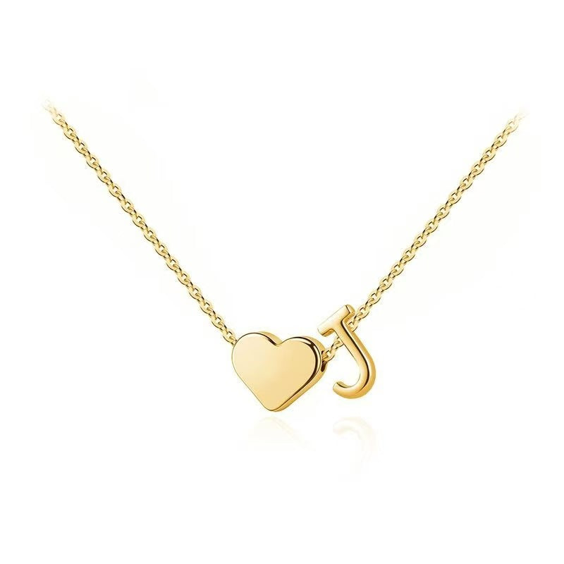 Personalized heart necklace with initials by ismijewels, featuring a delicate chain and custom engraved lover's initial design.
