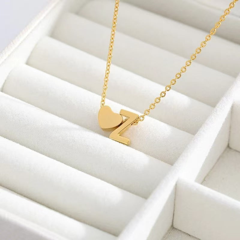Personalized heart necklace with initial engraving, custom lover's jewelry from ismijewels, featuring a delicate silver chain.