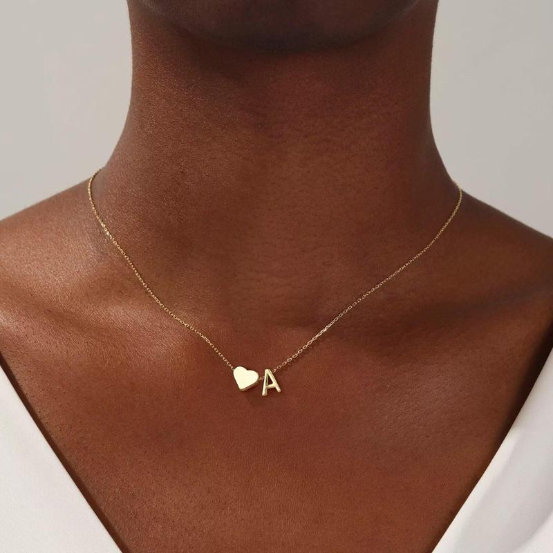 Personalized heart necklace with initial engraving from ismijewels, featuring a silver chain and a heart-shaped pendant.