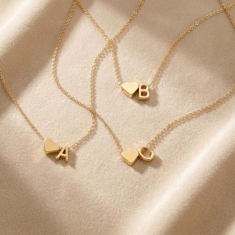 Personalized lover's heart necklace with initial engraving from ismijewels, featuring a delicate gold chain and heart pendant.
