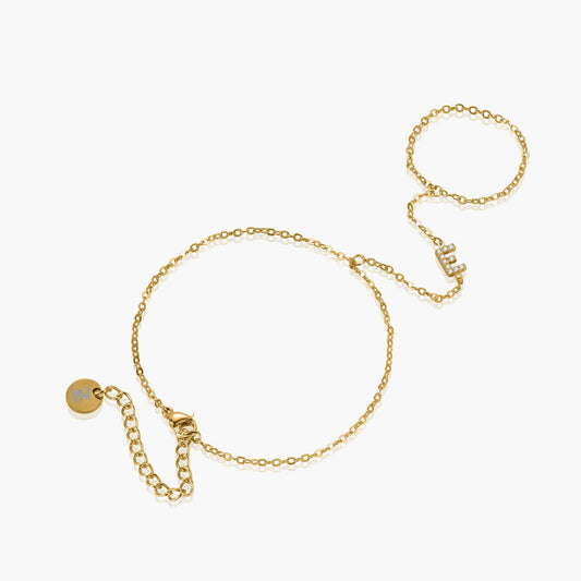 Gold personalized crystal initial hand chain bracelet with custom initial charm, featuring elegant design and delicate chain.