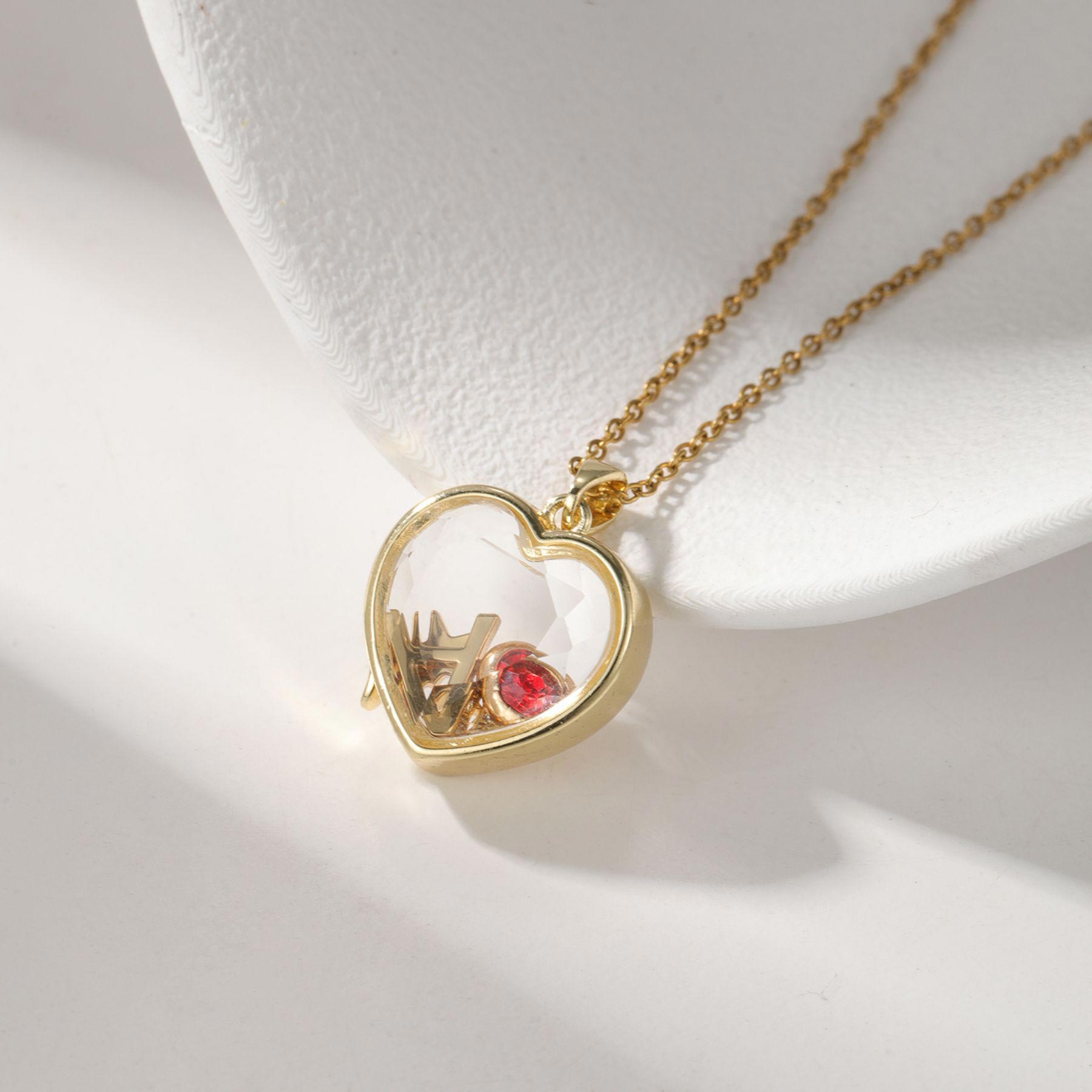 Personalized ismijewels heart locket necklace with charms, featuring intricate design and space for custom engravings and charms.