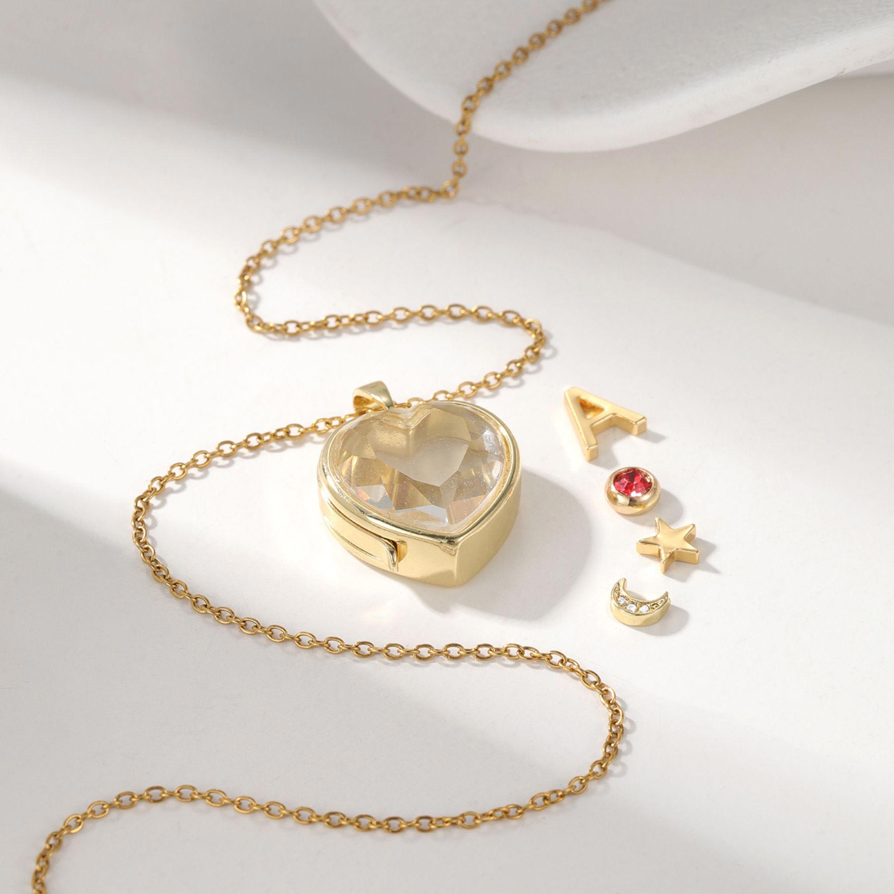 Personalized heart locket necklace with charms by ismijewels, featuring intricate details and customizable pendant design.