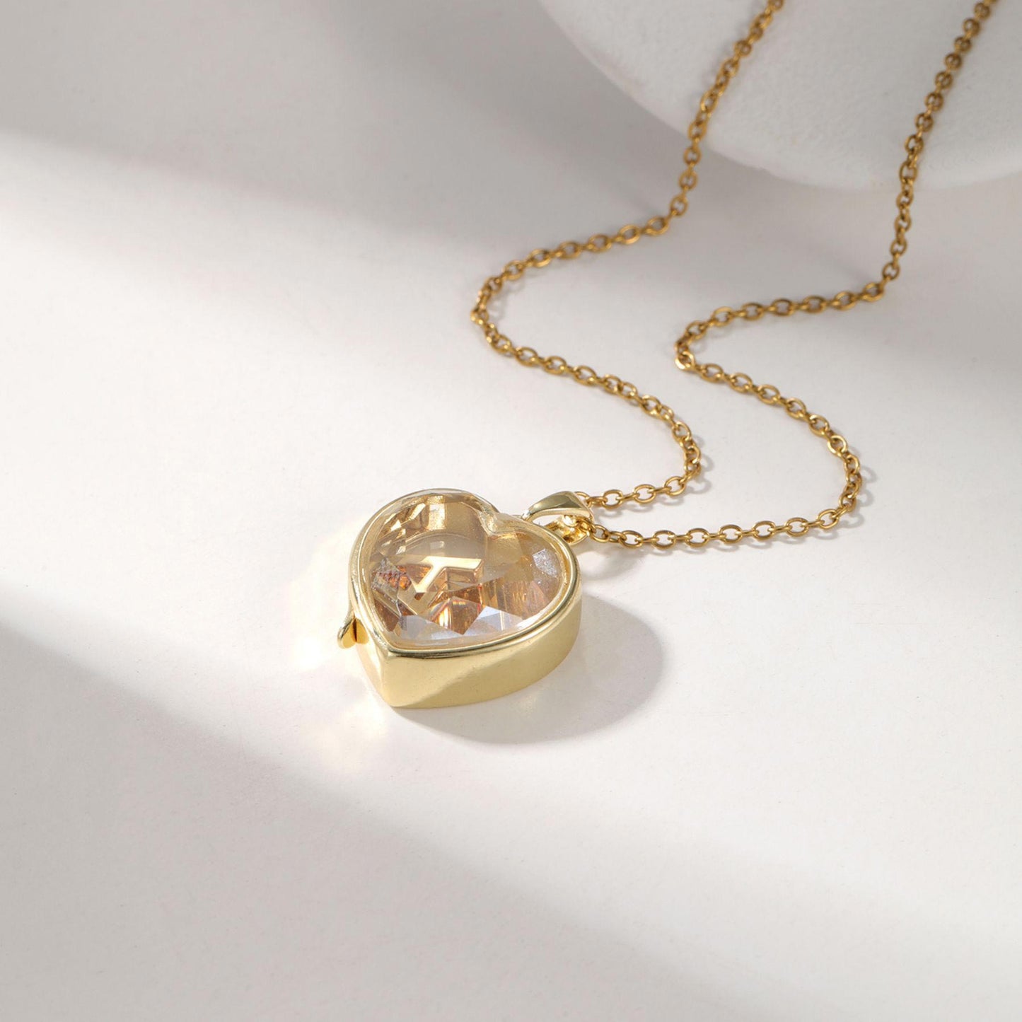 Personalized ismijewels heart locket with charms, featuring intricate details and a secure chain, ideal for sentimental jewelry lovers.