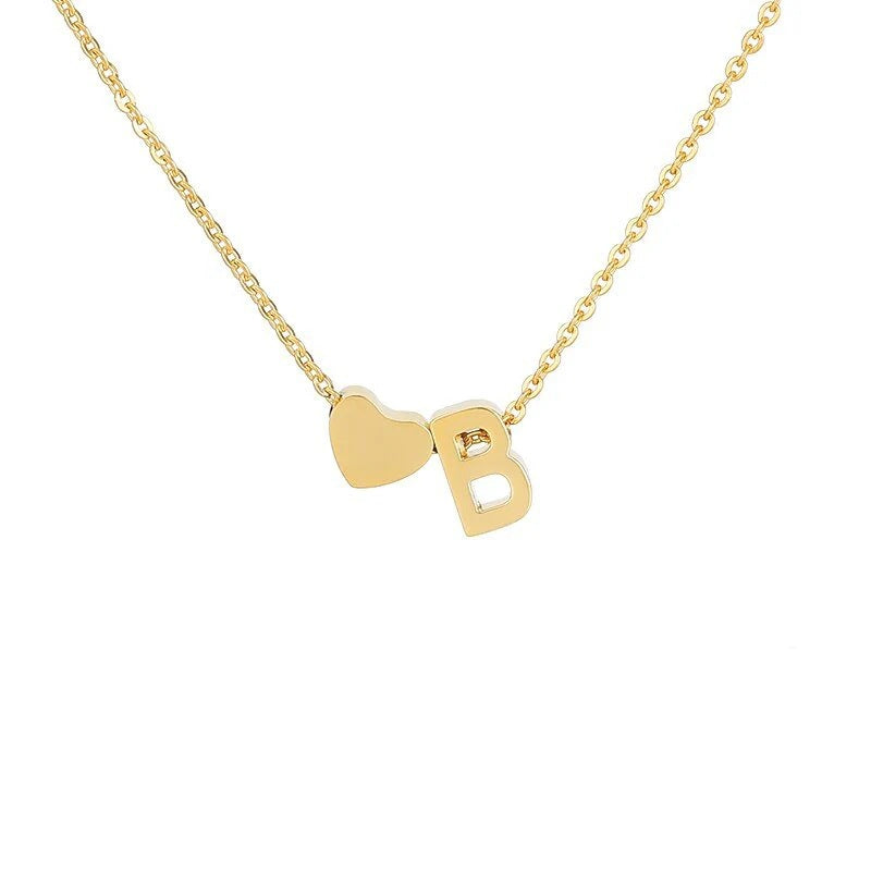 Personalized lover's heart necklace with initial engraving by ismijewels, featuring a delicate chain and heart-shaped pendant.